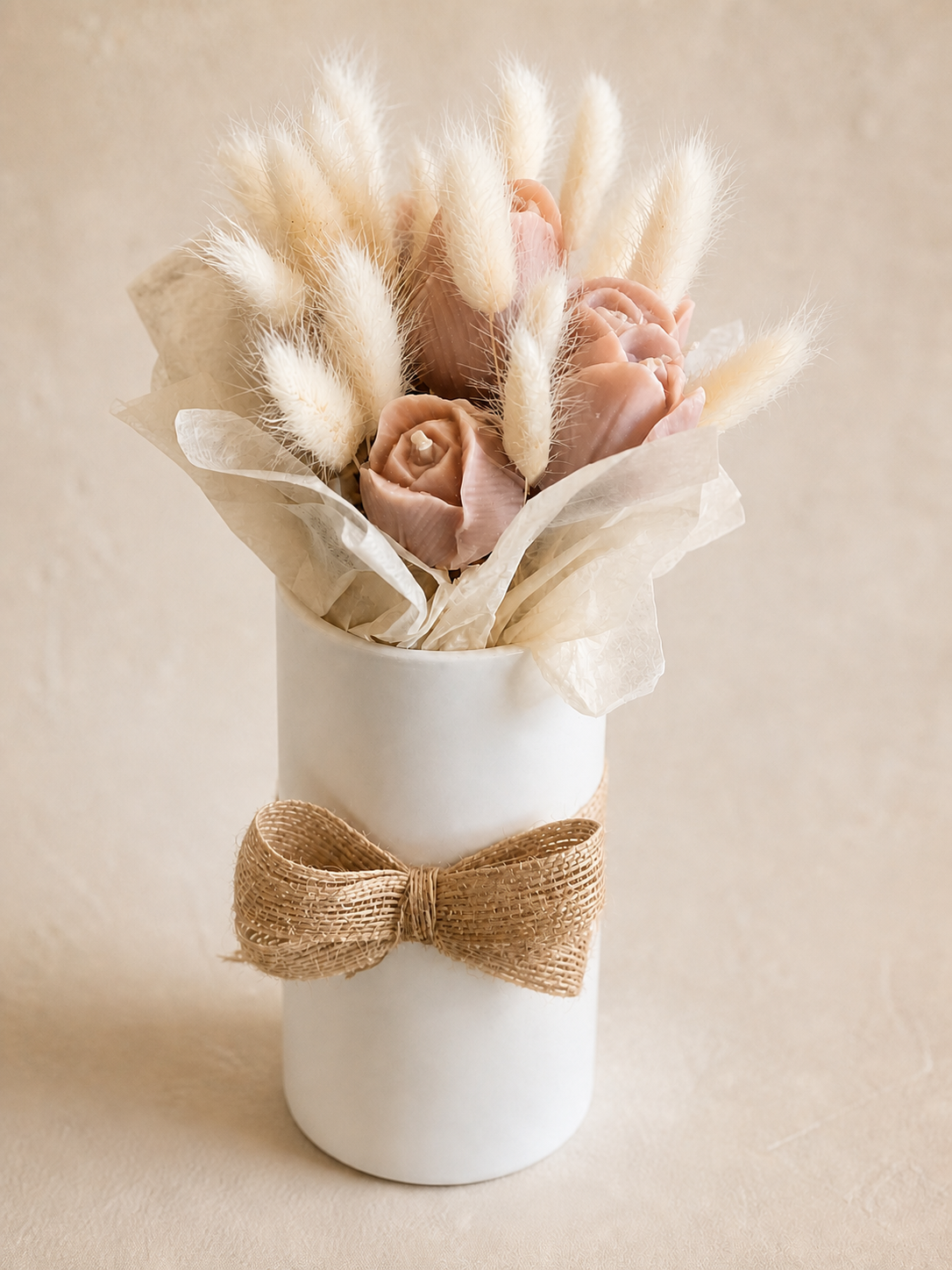 Six taupe tulip candles arranged with ivory botanicals