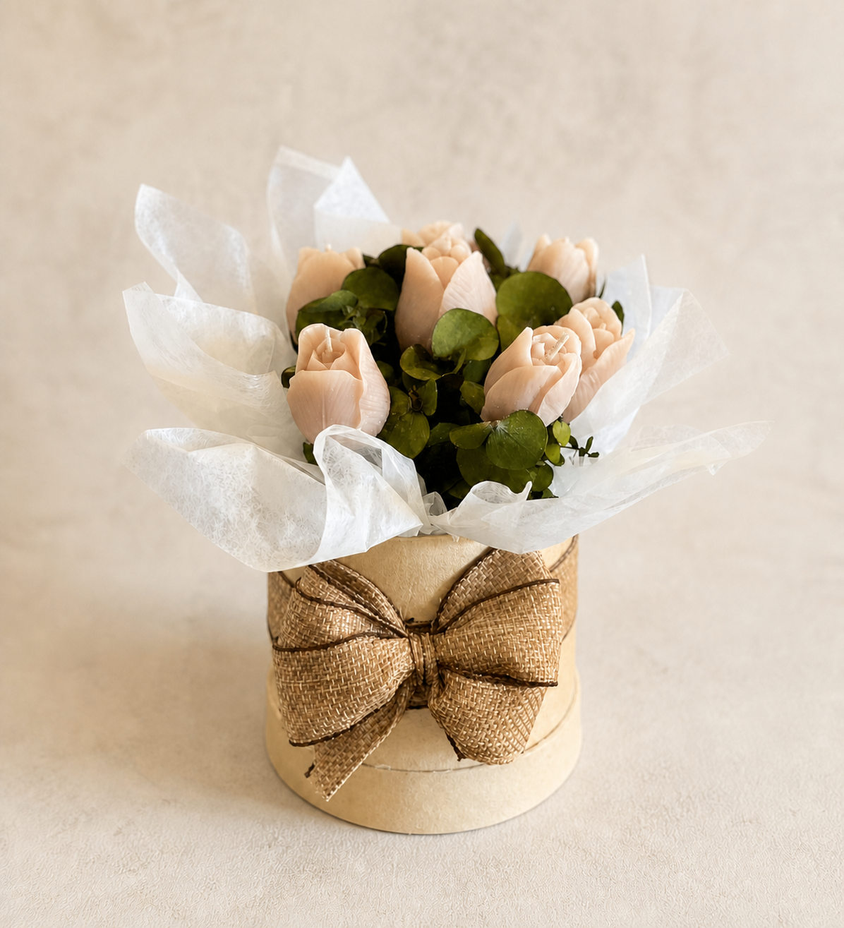 Six blush tulip candles in a medium neutral box