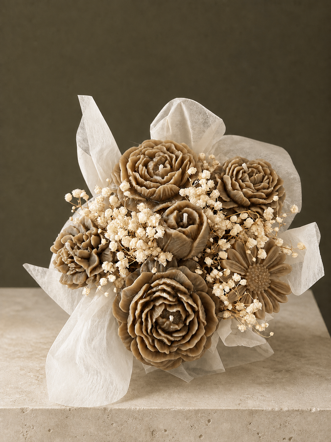 Abundant taupe sculptural flower candle bouquet with neutral botanicals