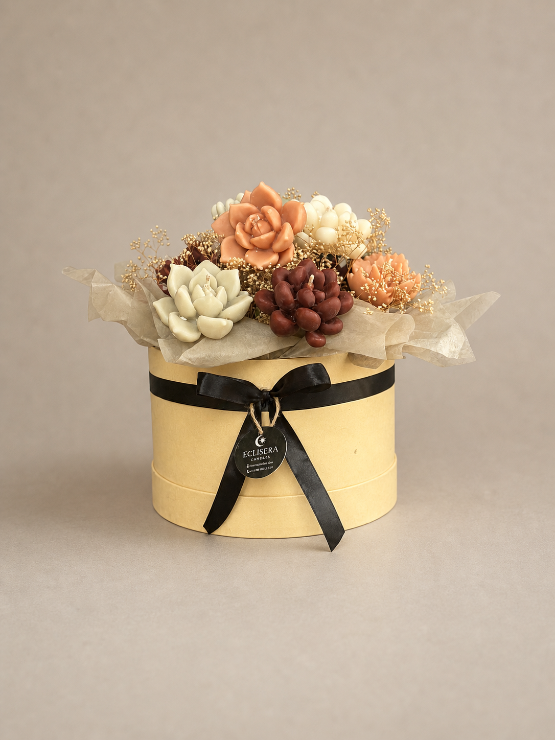 Autumn-toned succulent candle garden with layered desert botanicals