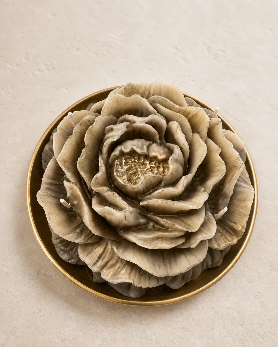 Overhead detail of a large taupe and ivory sculptural peony bowl candle