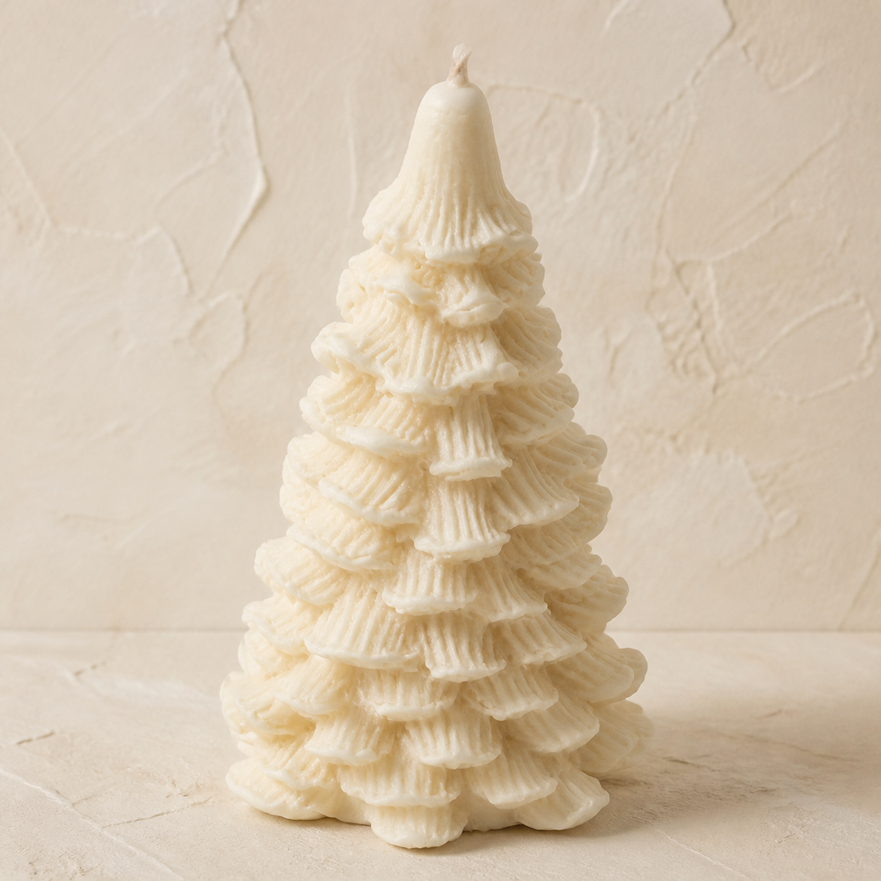 Ivory ribbed scallop holiday tree candle