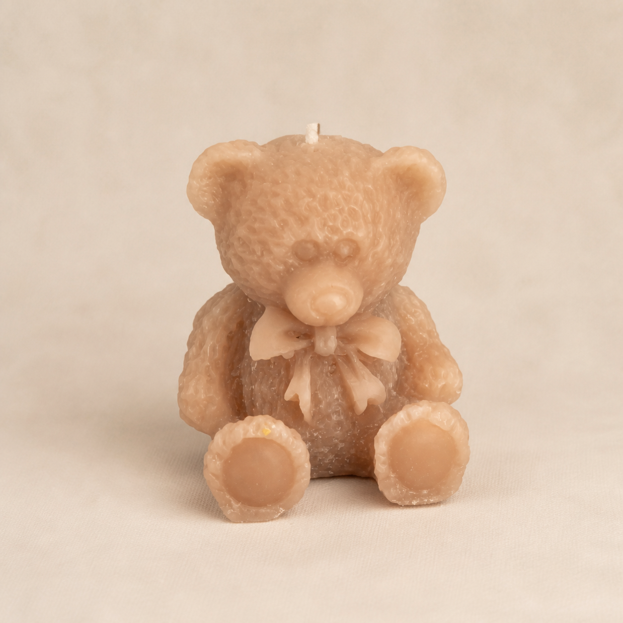 Taupe textured bow teddy candle